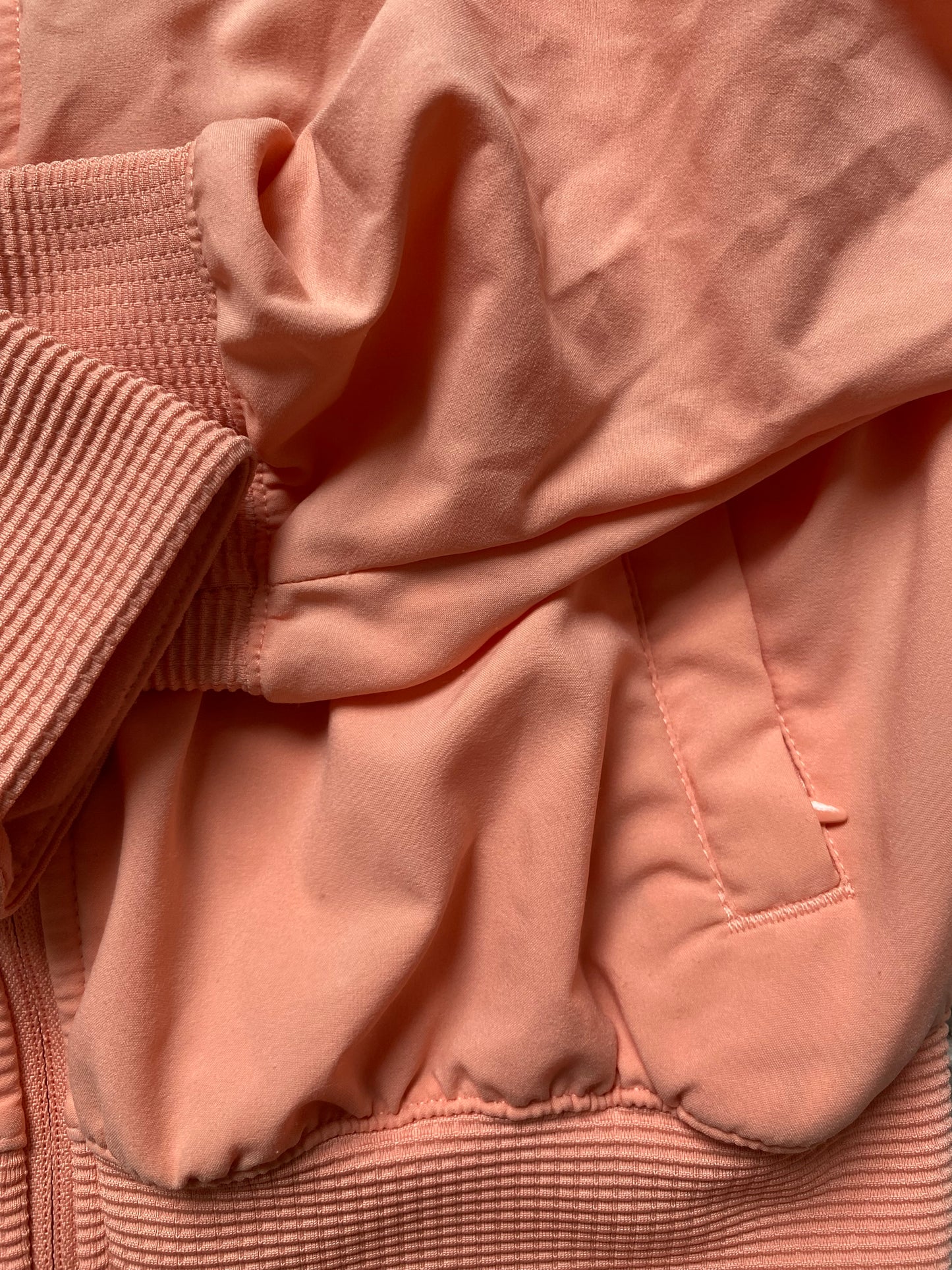 NIKE Girls Peach Jacket with Ruched Sleeves and Hidden Hood age 8-10